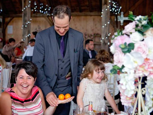 Barn wedding guests delighted by orange trick
